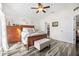 Spacious bedroom with wood-look floors and built-in storage at 92 Spinnaker Cir, South Daytona, FL 32119