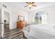 Bright bedroom with wood floors and an arched window at 92 Spinnaker Cir, South Daytona, FL 32119