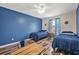 Bedroom with blue accent wall and two twin beds at 92 Spinnaker Cir, South Daytona, FL 32119