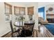 Charming kitchen dining area with round table and four chairs at 92 Spinnaker Cir, South Daytona, FL 32119