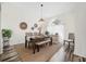 Bright dining area with wood table, bench seating, and an arched window at 92 Spinnaker Cir, South Daytona, FL 32119