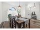 Spacious dining room with wooden table, chairs, and entryway view at 92 Spinnaker Cir, South Daytona, FL 32119