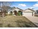 Single story house with arched entryway and attached two-car garage at 92 Spinnaker Cir, South Daytona, FL 32119