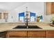 Modern kitchen sink with a black faucet and stylish countertops at 92 Spinnaker Cir, South Daytona, FL 32119