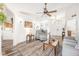 Bright living room with hardwood floors, comfy seating, and a ceiling fan at 92 Spinnaker Cir, South Daytona, FL 32119