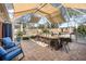 Outdoor patio with shaded dining area and relaxing seating at 92 Spinnaker Cir, South Daytona, FL 32119