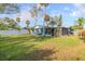 Large backyard with grassy lawn and view of house at 1214 Margina Ave, Daytona Beach, FL 32114