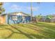 Large backyard with grassy lawn and view of house at 1214 Margina Ave, Daytona Beach, FL 32114