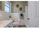 Clean bathroom with white tile, updated vanity, and shower/tub combo at 1214 Margina Ave, Daytona Beach, FL 32114