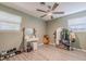 Bedroom with wood-look floors, white dresser, and clothing rack at 1214 Margina Ave, Daytona Beach, FL 32114