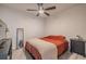 Bedroom with terracotta bedding, ceiling fan, and plenty of natural light at 1214 Margina Ave, Daytona Beach, FL 32114