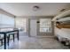 Sunroom with tiled floor, table and chairs, and surfboard storage at 1214 Margina Ave, Daytona Beach, FL 32114