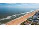 Aerial view of beach, ocean, and coastal homes at 1415 Ocean Shore Blvd # H040, Ormond Beach, FL 32176