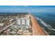 Aerial view showcasing beachfront location and building's proximity to the ocean at 1415 Ocean Shore Blvd # H040, Ormond Beach, FL 32176