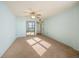 Bright bedroom with mirrored closet doors and carpet at 1415 Ocean Shore Blvd # H040, Ormond Beach, FL 32176