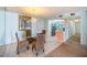 Dining area with glass table and chairs, adjacent to kitchen at 1415 Ocean Shore Blvd # H040, Ormond Beach, FL 32176