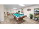 Game room with pool table, ping pong, and seating area at 1415 Ocean Shore Blvd # H040, Ormond Beach, FL 32176