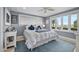 Cozy bedroom with water views and a ceiling fan at 1778 John Anderson Dr, Ormond Beach, FL 32176