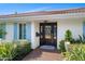 House exterior with light blue shutters and a dark brown door at 1778 John Anderson Dr, Ormond Beach, FL 32176