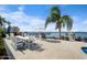 Outdoor dining area with water views and fireplace at 1778 John Anderson Dr, Ormond Beach, FL 32176