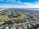 Aerial view of the property and surrounding neighborhood near the ocean at 200 Country Club Dr, Ormond Beach, FL 32176