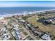 Aerial view showing the property's location near the beach and golf course at 200 Country Club Dr, Ormond Beach, FL 32176