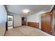 Simple bedroom with wood accent wall and carpet at 2050 Anne Cir, South Daytona, FL 32119