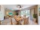 Casual dining area with wood table and wicker chairs near sliding doors at 2050 Anne Cir, South Daytona, FL 32119