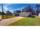 House exterior with attached garage and driveway at 2050 Anne Cir, South Daytona, FL 32119