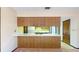 View of kitchen with wood cabinets, an eat-in island at 2050 Anne Cir, South Daytona, FL 32119