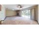 Spacious living area with fireplace and backyard access at 2050 Anne Cir, South Daytona, FL 32119