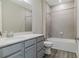 Bathroom with grey vanity, shower, and tub at 2212 Oconnel Dr, Ormond Beach, FL 32174