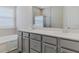 Double vanity bathroom with modern gray cabinets at 2212 Oconnel Dr, Ormond Beach, FL 32174