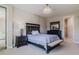 Bedroom with dark wood furniture and en-suite bath at 2212 Oconnel Dr, Ormond Beach, FL 32174