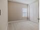 Simple bedroom with neutral walls and carpet at 2212 Oconnel Dr, Ormond Beach, FL 32174