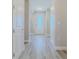 Bright entryway with tile floors and white doors at 2212 Oconnel Dr, Ormond Beach, FL 32174