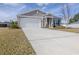 One-story house with a two-car garage and driveway at 2212 Oconnel Dr, Ormond Beach, FL 32174