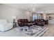 Living room with leather sofas and view of kitchen at 2212 Oconnel Dr, Ormond Beach, FL 32174