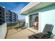 Balcony with ocean view and lounge chairs at 2850 Ocean Shore Blvd # 8, Ormond Beach, FL 32176