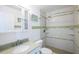 Clean bathroom with walk-in shower and green tile accents at 2850 Ocean Shore Blvd # 8, Ormond Beach, FL 32176