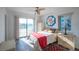 Bedroom with ocean view and wicker furniture at 2850 Ocean Shore Blvd # 8, Ormond Beach, FL 32176