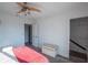 Bedroom with red blanket and wicker storage chest at 2850 Ocean Shore Blvd # 8, Ormond Beach, FL 32176