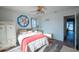 Bedroom with ocean view and wicker furniture at 2850 Ocean Shore Blvd # 8, Ormond Beach, FL 32176