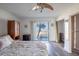 Ocean-view bedroom with king-size bed and built-in shelving at 2850 Ocean Shore Blvd # 8, Ormond Beach, FL 32176