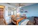 Dining area with table and chairs, view into kitchen and living room at 2850 Ocean Shore Blvd # 8, Ormond Beach, FL 32176