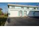 Front view of beach house with attached garage at 2850 Ocean Shore Blvd # 8, Ormond Beach, FL 32176