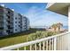 Balcony view of ocean and beach with construction in the distance at 2850 Ocean Shore Blvd # 8, Ormond Beach, FL 32176