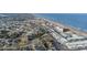 Wide aerial view of a beachfront condo complex with a red pin on the rooftop at 2850 Ocean Shore Blvd # 8, Ormond Beach, FL 32176