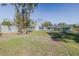 Large backyard with shed and mature trees at 328 Dubs Dr, Holly Hill, FL 32117