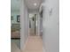 Light and airy hallway with tile flooring at 328 Dubs Dr, Holly Hill, FL 32117